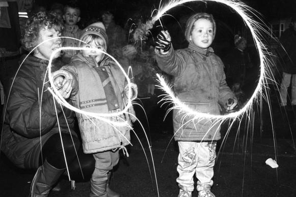 It’s fireworks night in 1990 but can you recognise the people pictured with sparklers?