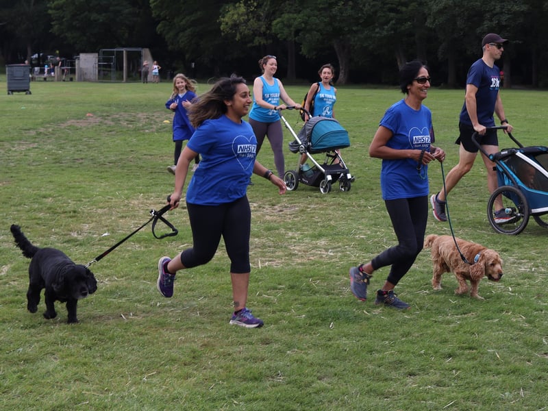 Runners jog along with their dogs 