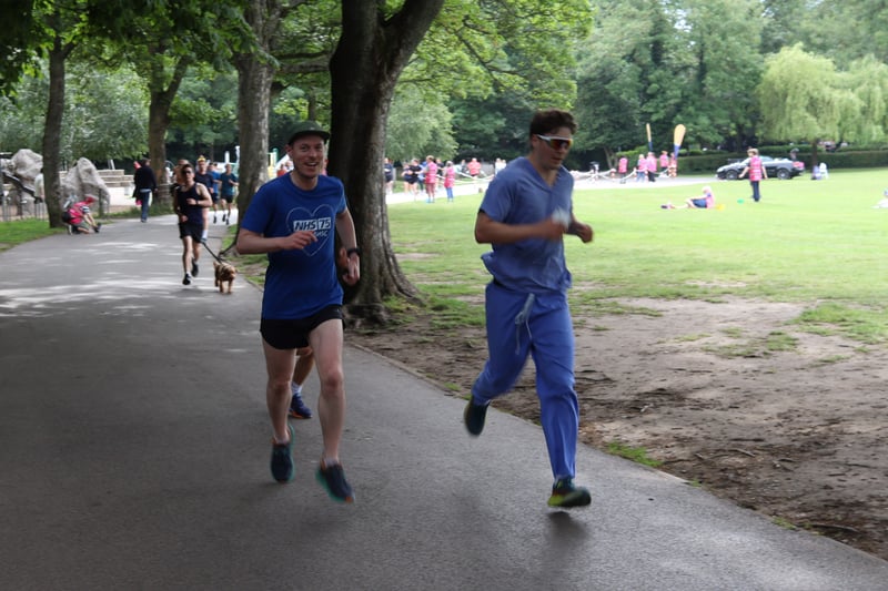 Two runners dressed in blue join in 