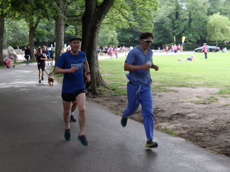 Two runners dressed in blue join in