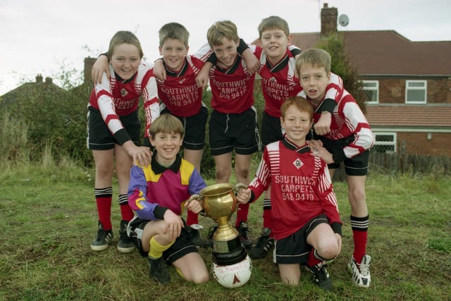 The 1996 St Benet's Primary School team with the cup they won for the city under-11 football tournament . Left to right are back: James Smith, Neil Ebdon, Michael McVay, Anthony Douthwaite and Craig Hubbard. Front: Martin McGill and Shaun Donkin, captain.
