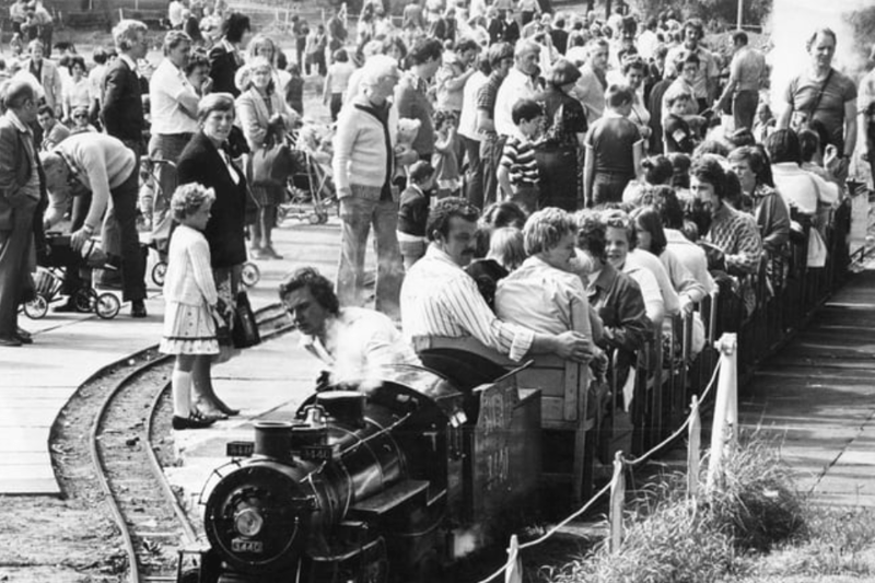 Bank Holiday crowds at the South Marine Park in August 1980. They are watching as a steam engine takes another load of passengers for a trip around the lake. Photo: Shields Gazette