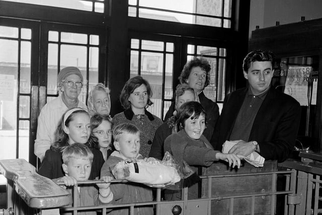 Customers waiting at the turnstile of Portobello Outdoor Swimming Pool in 1965.