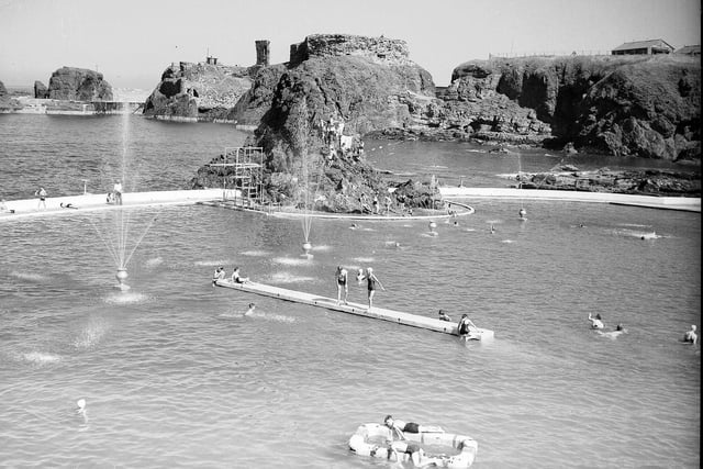 The remains of Dunbar Castle overlooking the outdoor swimming pool in 1953. 