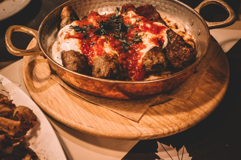 Located on Hagley Road, this offers a menu of traditional Iranian comfort food in a rustic setting with booth & banquette seating. (Photo - Unsplash/Dimitris Chasoulas)