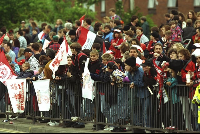 Manchester United fans await their heroes on the streets of Manchester during their homecoming celebrations after winning the FA Cup against Chelsea in 1994