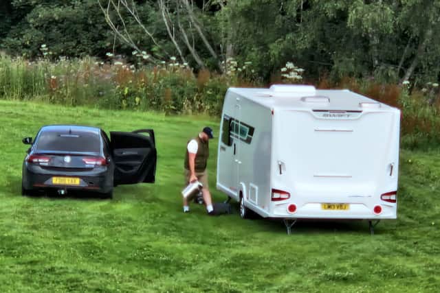 Adults could be seen going in and out of caravans at Crookes Cemetery field