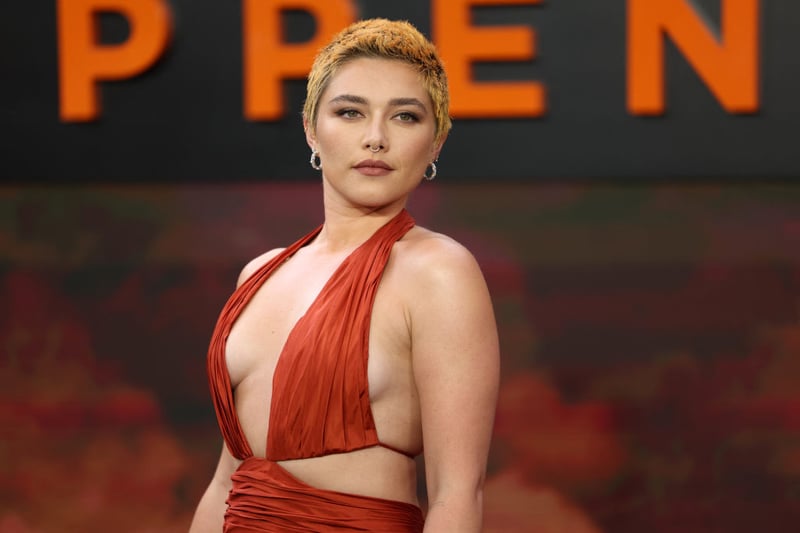 British actor Florence Pugh poses for photos on the red carpet.