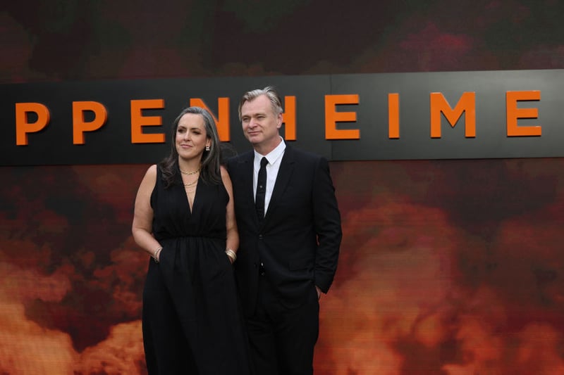 Oppenheimer director Christopher Nolan poses with his wife and film producer Emma Thomas.