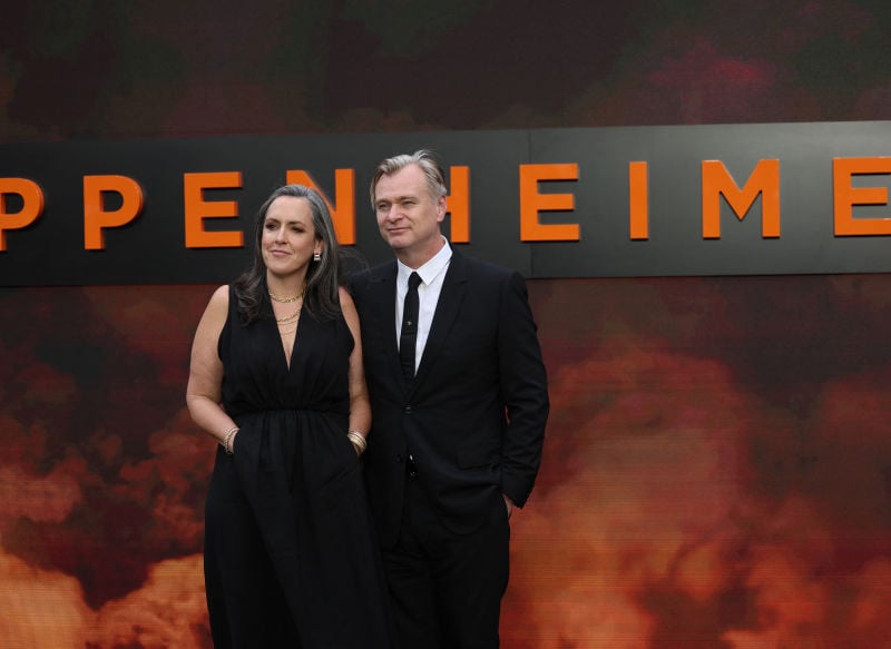Oppenheimer director Christopher Nolan poses with his wife and film producer Emma Thomas.