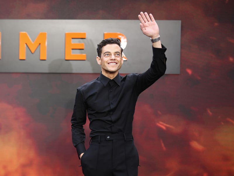 American actor Rami Malek says hello to waiting fans at the Oppenheimer premiere.
