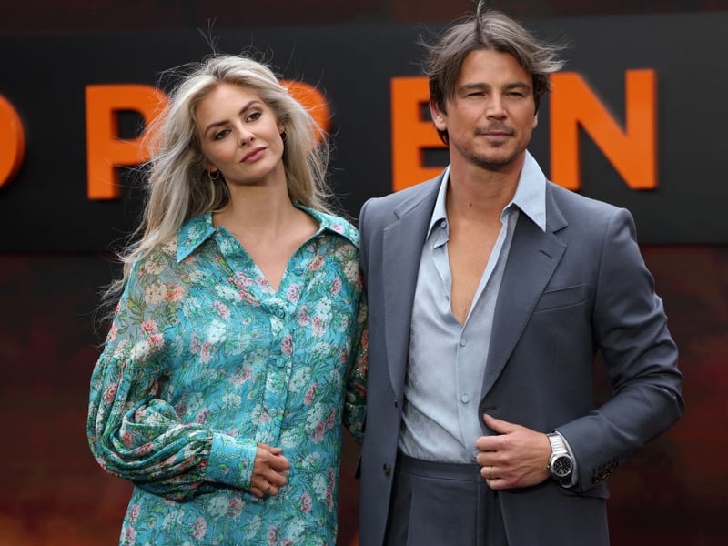 US actor Josh Hartnett and his wife Tamsin Egerton pose on the red carpet upon arrival for the UK premiere of Oppenheimer.