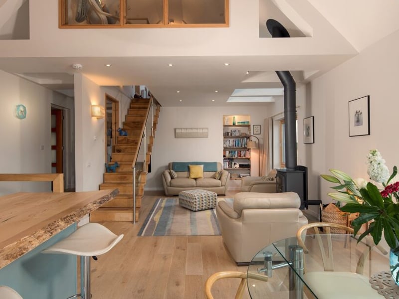 The gorgeous double-height living area has toasty underfloor heating.