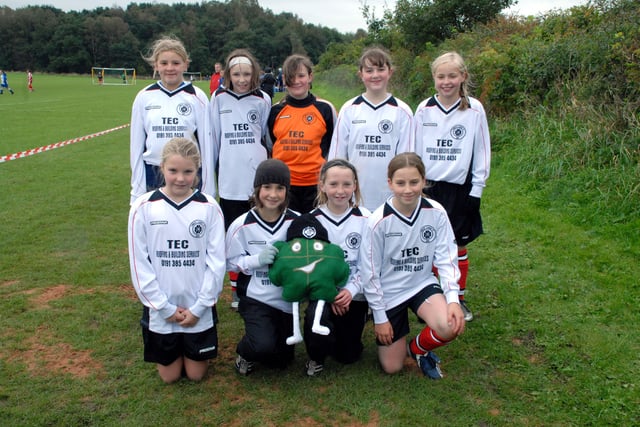 The Lumley Ladies under-12 team  pictured pitchside in 2007 with their mascot.