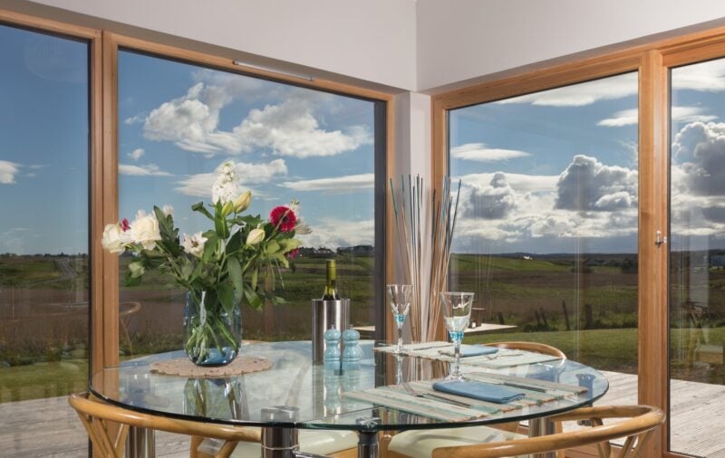 The dining table has incredible views over the island countryside.