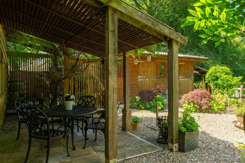 The rear gardens features multiple patio areas. (Photo by Monroe Estate Agents)