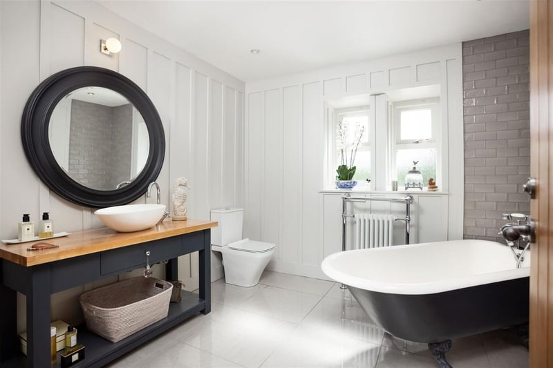 A stunning family bathroom with unique design and a large bathtub. (Photo by Monroe Estate Agents)