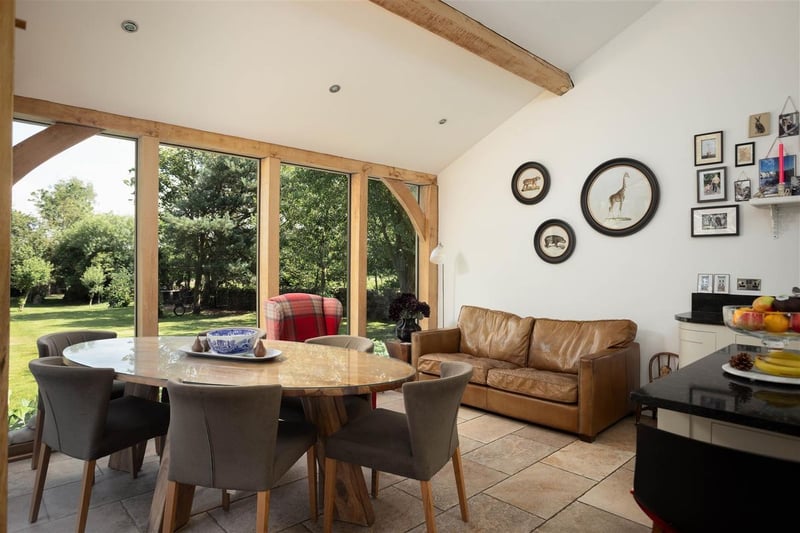 Glass doors connect the dining area and the large rear gardens. (Photo by Monroe Estate Agents)