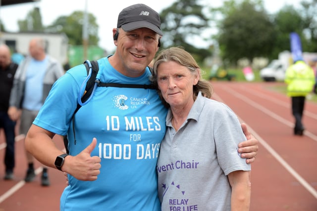 Annual Cancer Research UK Relay for Life organiser Ann Walsh at Monkton Stadium with David Ansell who is walking 10 miles a day for a 100 days.