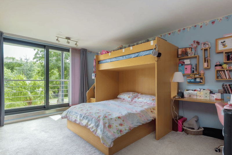 This kid's bedroom has loads of space.