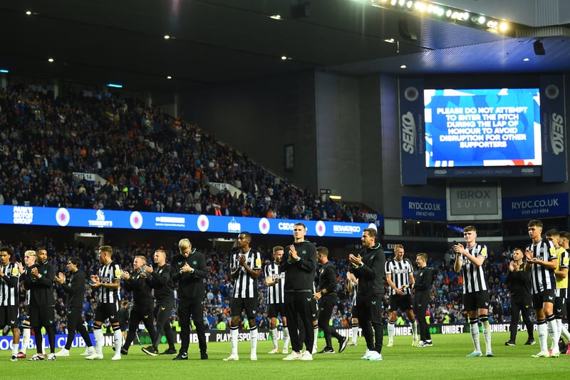 The Newcastle players applaud their 8,000-strong travelling contingent at Ibrox after the full-time whistle.