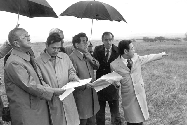 Nissan officials accompanied by members of the negotiating team examine the site at Sunderland Airport shortly before the announcement of the decision to come to Wearside.