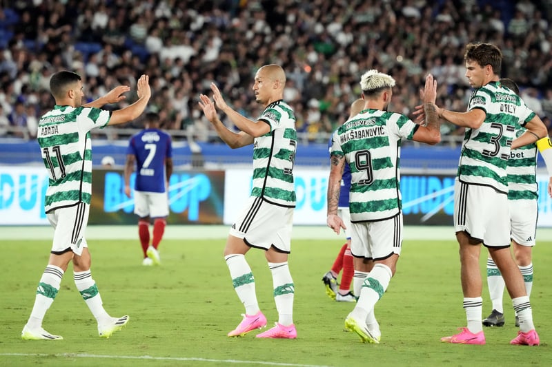 The Celtic players congratulate each other after taking a slender 3-2 lead into the break. 