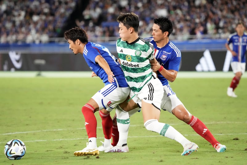 Substitue Oh Hyeon-gyu is sandwiched in between two Yokohama players as he attempts to win back possession of the ball.