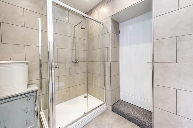 The home boasts a shower room and a bathroom. 