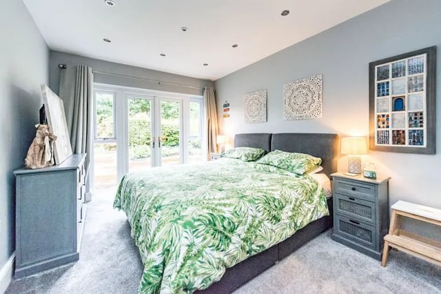 All three bedrooms are at the front of the home. The master bedroom, pictured, has large doors that open up onto the private and secure garden, filling the room with light.