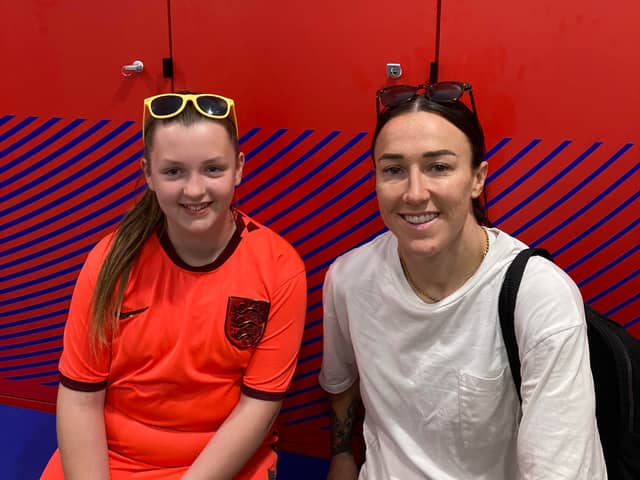 Leah Walton, 10, with the England player Lucy Bronze, who has praised the youngster for selling World Cup-themed homemade scrunchies and keyrings to raise money for four-year-old Jude Mellon-Jameson, who is battling cancer. Photo: Craig Walton/PA Wire