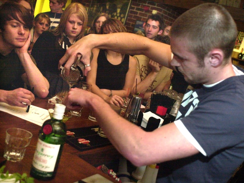 Ian Bowan, of Halcyon, competes in a cocktail competition at Menzel's Wine Bar, on Ecclesall Road, Sheffield, watched by one of the judges Andy Rogers (left)