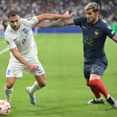 Sheffield United’s George Baldock in action against France’s Theo Hernandez while playing for Greece