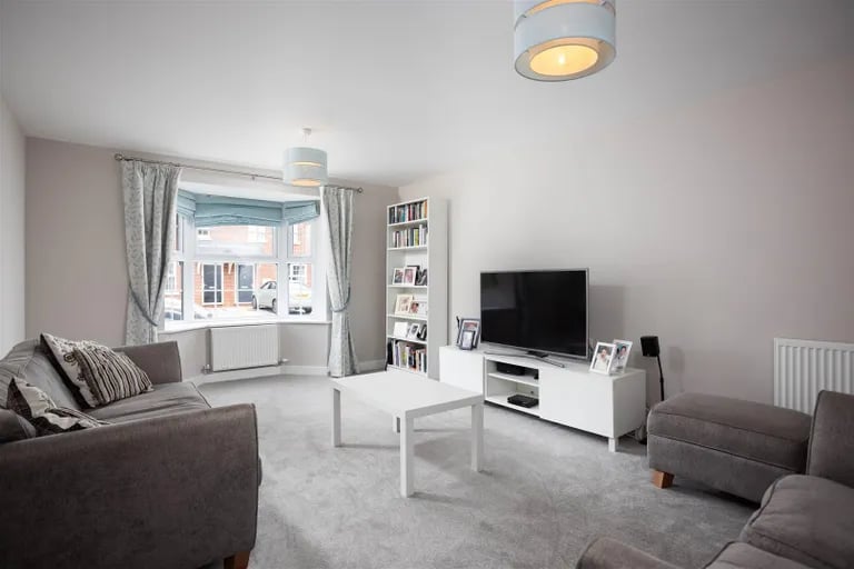 The spacious living room with bay window. Picture by Monroe Estate Agents