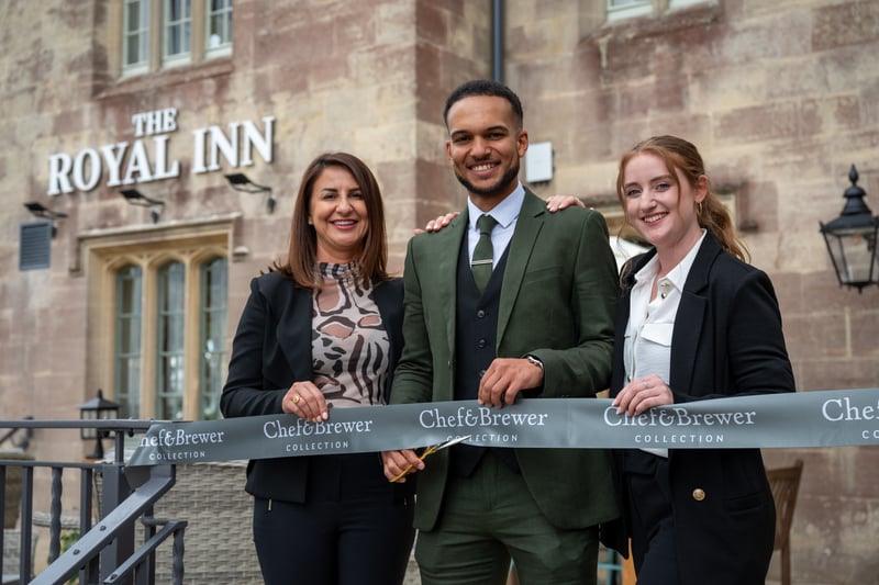 New General Manager Kaman Miller cuts the ribbon at the official launch of The Royal Inn.