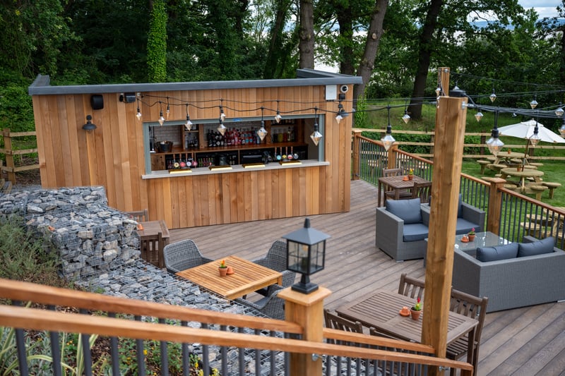 The new outdoor bar on the stylish decking is sure to be a draw over the summer