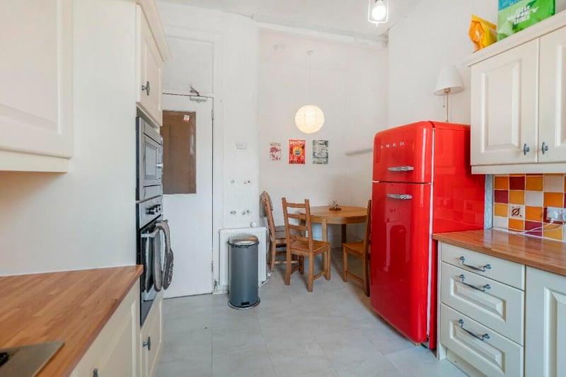 The kitchen in the property has room for a dining space and a large fridge. 