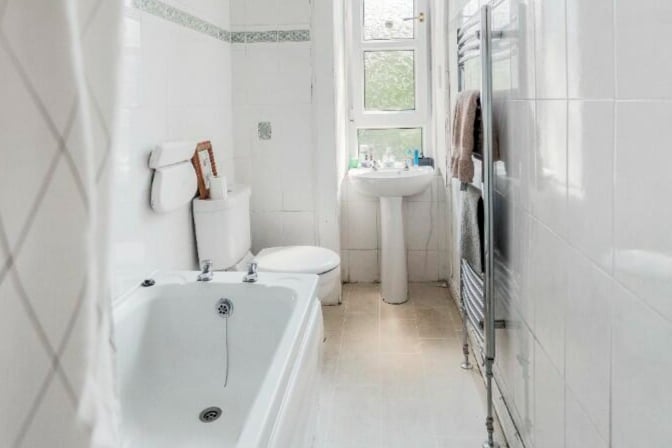The bathroom has a bath and power-shower overhead with it also featuring a heated towel rail. 