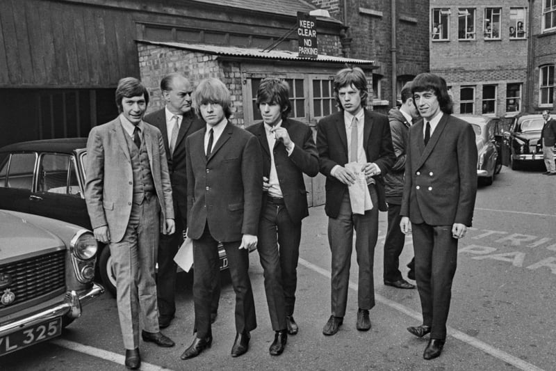 The Rolling Stones arrive at West Ham Magistrate's Court in London, UK, 22nd July 1965. Three of them are facing charges related to an incident at an all-night garage in East London. From left to right, Charlie Watts, Brian Jones, Keith Richards, Mick Jagger and Bill Wyman. (Photo by Evening Standard/Hulton Archive/Getty Images)