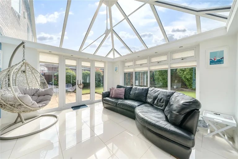 The bright and luxurious conservatory opens up to the rear garden. Picture by Manning Stainton