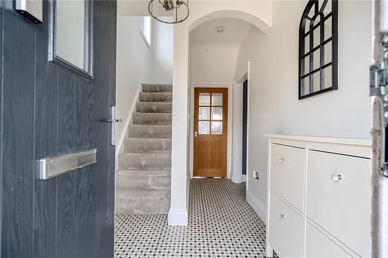 The charming entry hall with stairs to the first floor. Picture by Manning Stainton