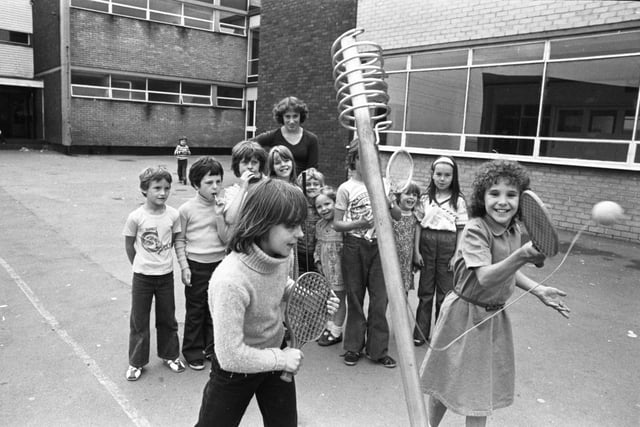 Tracey Cumming serves to Tracey Cook during a game of swing-ball at the Red House play scheme in 1978.