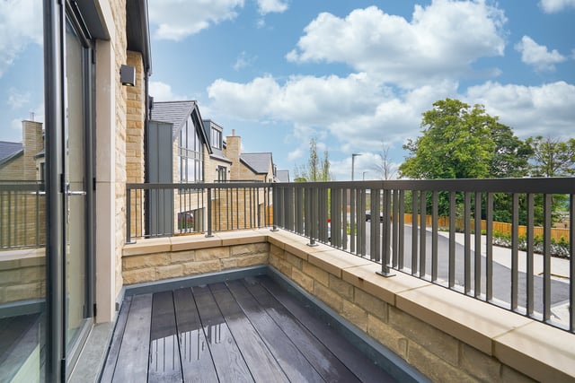 On the first floor at the end of the main lounge, a terraced balcony overlooks the gated estate