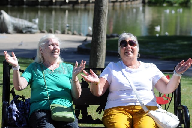 Jean Roberts and Heather Tucknutt enjoy the heatwave in Mowbray Park in June 2018.