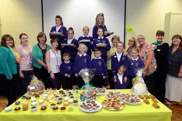 Some of the staff and pupils at Hastings Hill Academy, Tilbury Road, who raised over £600 during the Macmilan Worlds Biggest Coffee Morning in 2013.