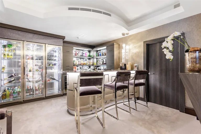 Enjoy a drink at this luxurious private bar, located in the largest of the living rooms. Picture by Fine & Country