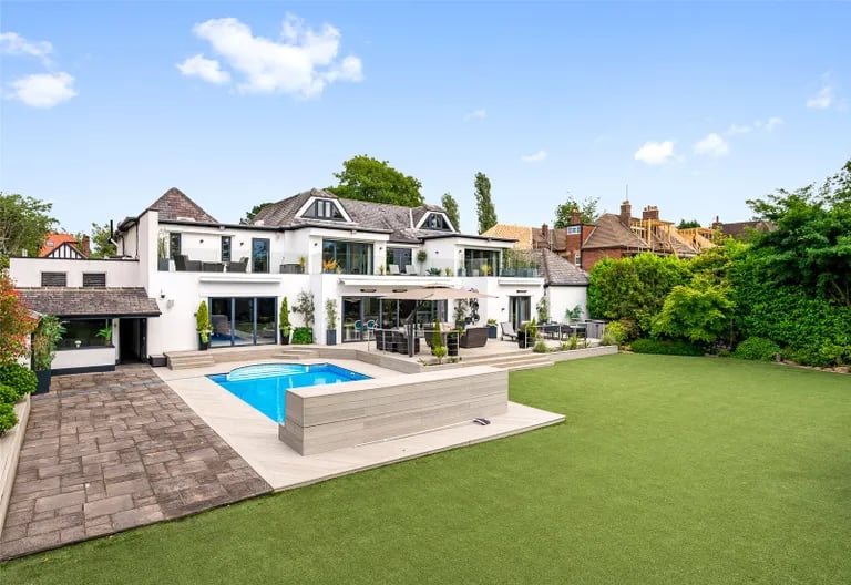 The rear garden features a large lawn, patio, pool, jacuzzi and more. Picture by Fine & Country
