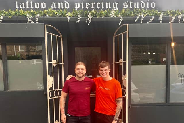 Adam Clarke and Mitchell Barry outside the Eleven Eleven Tattoo Studio on City Road.