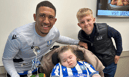 Sheffield Wednesday's Liam Palmer with 'Super' Shay O'Grady and his beloved cousin Evie-May O'Grady Askwith, who often spends time at Bluebell Wood.
