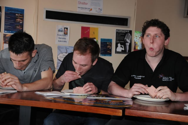 They're off....students, from left; Liam Bell 22, Adam Gawne 23, and Andy Leadbitter 24, take part in the Spam eating contest at Sunderland University in 2011.